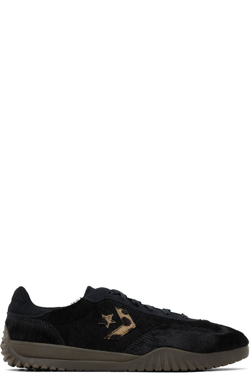 Low-top hair-on leather sneakers in black.

· Suede trim throughout
· Lace-up closure
· Logo embossed at padded tongue
· Padded collar
· Logo appliqué at sides
· Logo embossed at heel tab
· Rubberized logo appliqué at heel
· Cushioned CX foam footbed
· Mesh lining
· Treaded rubber sole

Supplier color: Black/Black/Brown