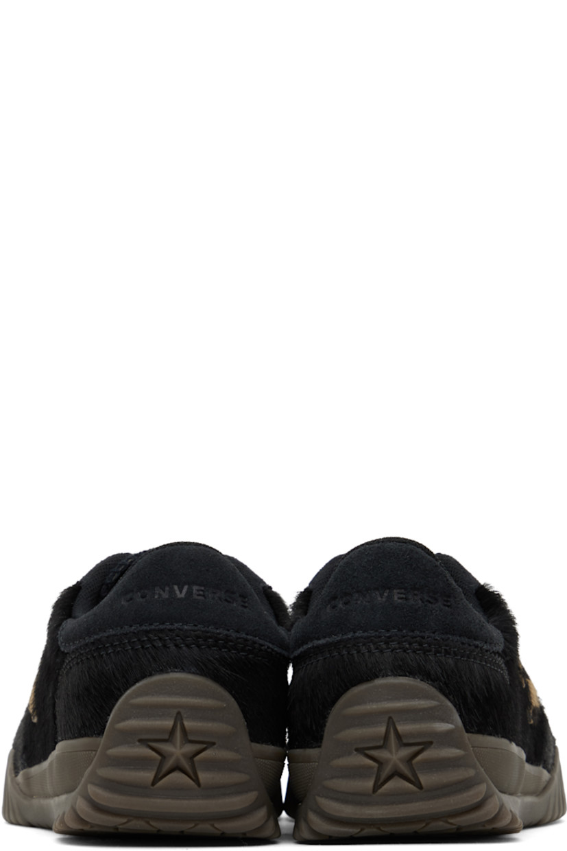 Low-top hair-on leather sneakers in black.

· Suede trim throughout
· Lace-up closure
· Logo embossed at padded tongue
· Padded collar
· Logo appliqué at sides
· Logo embossed at heel tab
· Rubberized logo appliqué at heel
· Cushioned CX foam footbed
· Mesh lining
· Treaded rubber sole

Supplier color: Black/Black/Brown