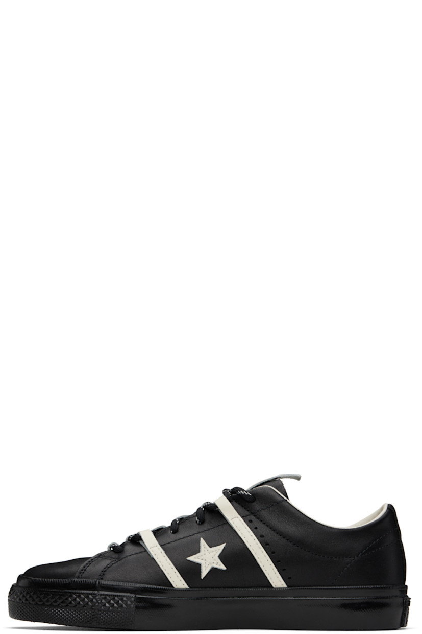 Low-top buffed leather sneakers in black.

· Lace-up closure
· Pull-tab at tongue
· Concealed elasticized gusset at tongue
· Padded collar
· Logo and stripe appliqués at sides
· Perforated detailing at sides
· Cushioned CX foam insole
· Canvas and mesh lining
· Rubberized logo patch at heel
· Treaded rubber sole
· Includes alternate laces in black

Part of the Converse x Bobby Dekeyzer collaboration.

Supplier color: Black/Egret/Black