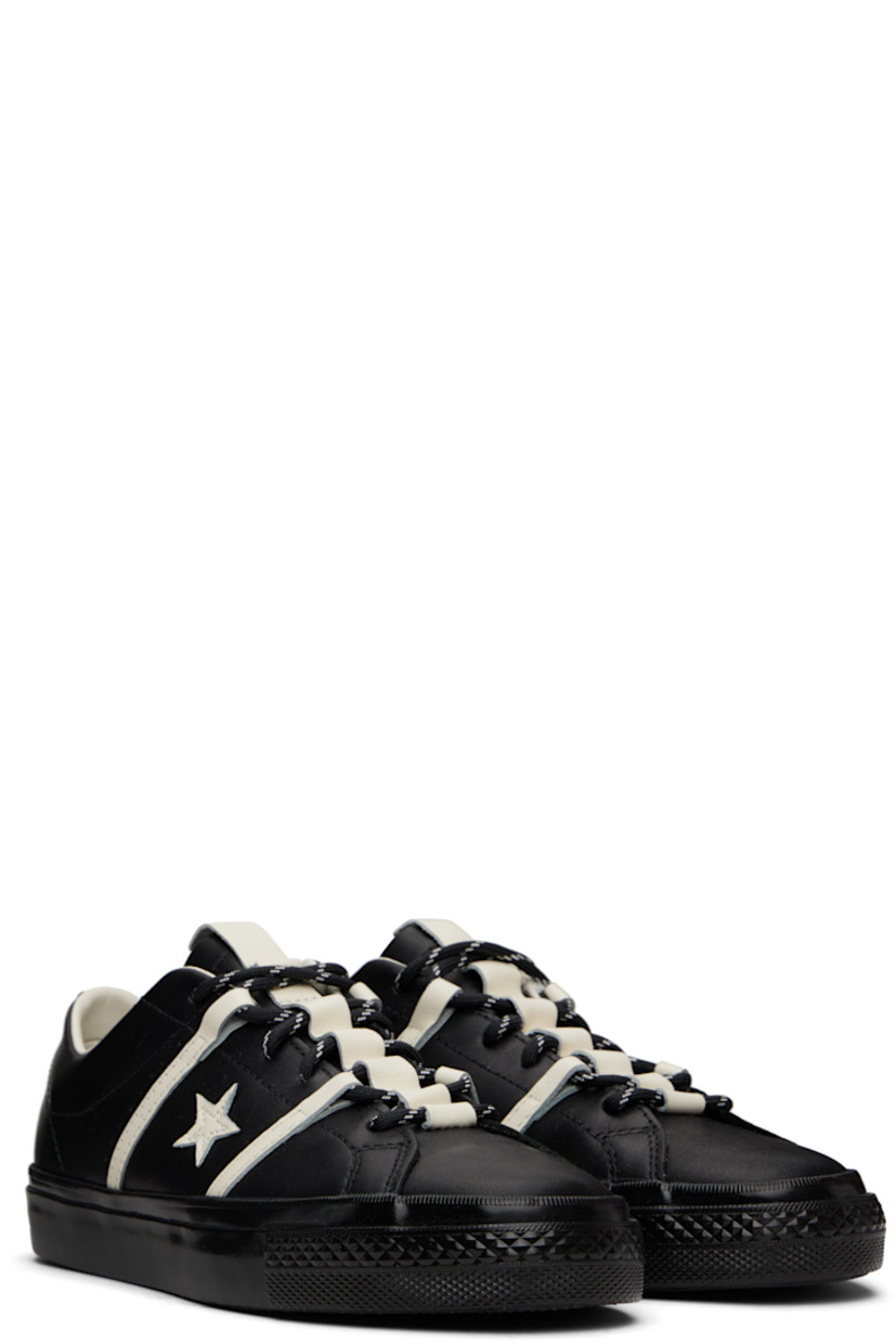 Low-top buffed leather sneakers in black.

· Lace-up closure
· Pull-tab at tongue
· Concealed elasticized gusset at tongue
· Padded collar
· Logo and stripe appliqués at sides
· Perforated detailing at sides
· Cushioned CX foam insole
· Canvas and mesh lining
· Rubberized logo patch at heel
· Treaded rubber sole
· Includes alternate laces in black

Part of the Converse x Bobby Dekeyzer collaboration.

Supplier color: Black/Egret/Black
