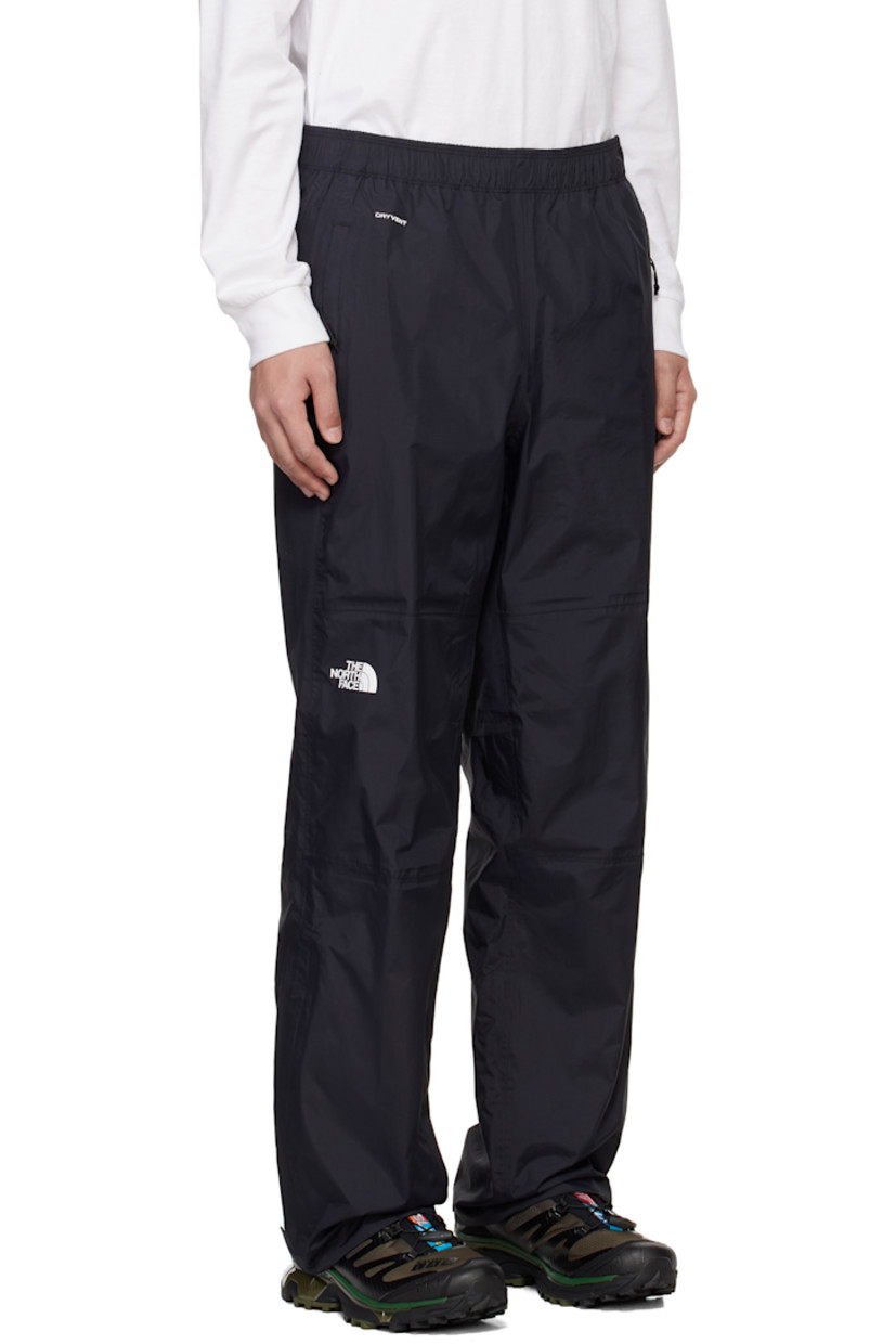 Loose-fit DryVent™ nylon ripstop trousers. Wind-resistant and non-PFC DWR-coated waterproof.

· Concealed drawstring at elasticized waistband
· Two-pocket styling
· Text bonded at waist
· Logo bonded at leg
· Zip vent and velcro tab at cuffs
· Partial mesh lining

Supplier color: TNF black