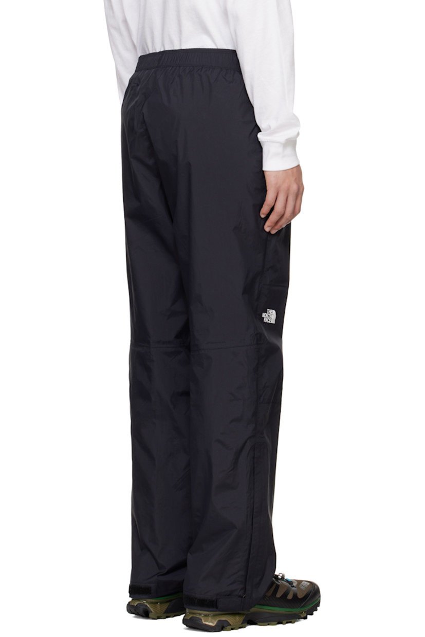 Loose-fit DryVent™ nylon ripstop trousers. Wind-resistant and non-PFC DWR-coated waterproof.

· Concealed drawstring at elasticized waistband
· Two-pocket styling
· Text bonded at waist
· Logo bonded at leg
· Zip vent and velcro tab at cuffs
· Partial mesh lining

Supplier color: TNF black