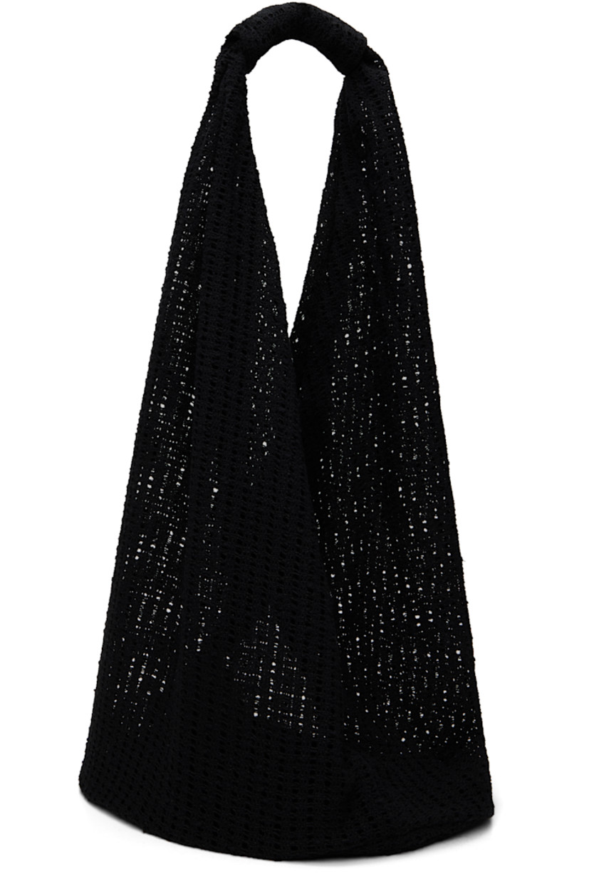 Crocheted tote in black.

· Integrated shoulder strap
· Open throat
· Unlined
· H13" x W14.5" x D10"
· Total height: H26"

Supplier color: Black crochet
