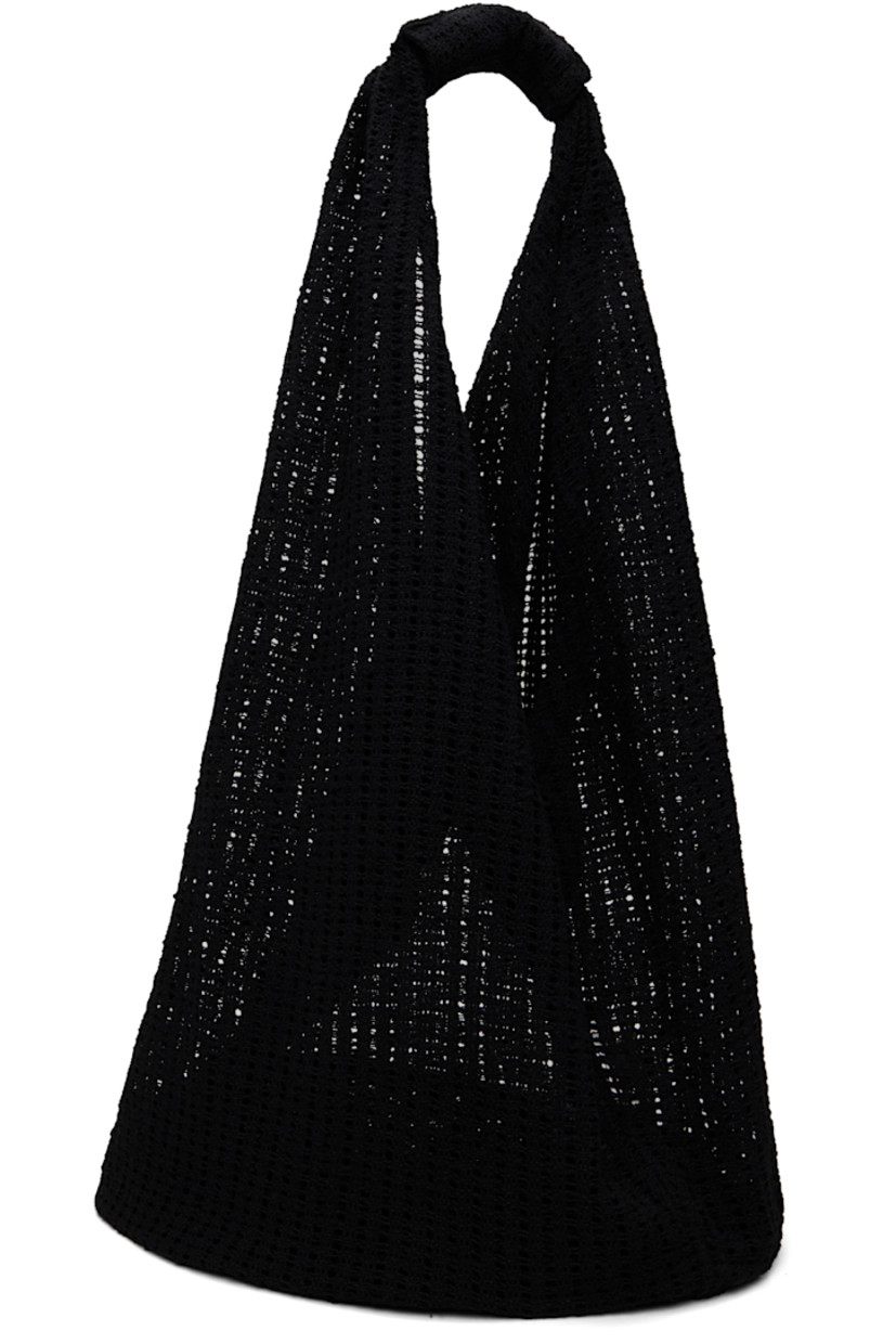 Crocheted tote in black.

· Integrated shoulder strap
· Open throat
· Unlined
· H13" x W14.5" x D10"
· Total height: H26"

Supplier color: Black crochet