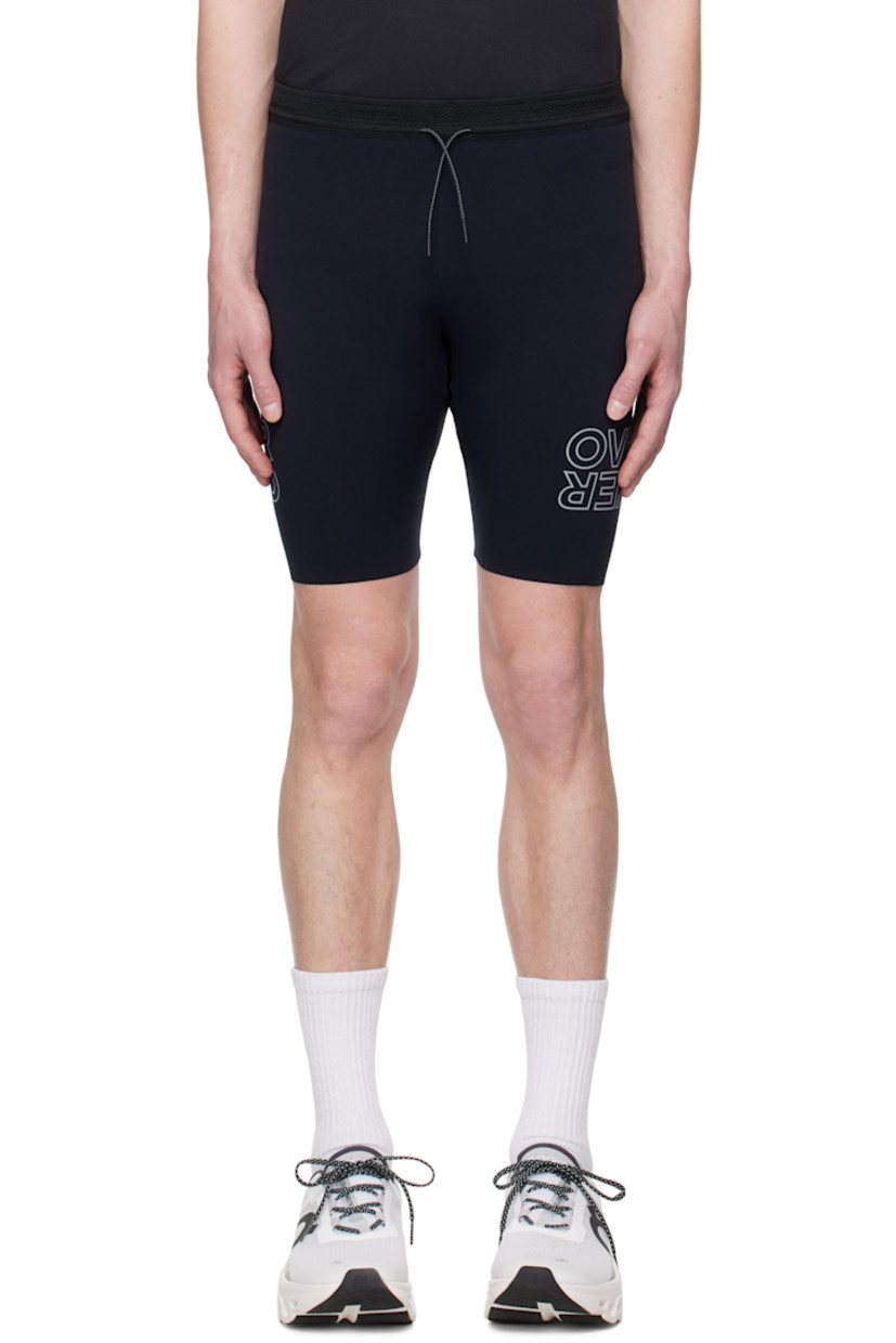 Stretch nylon jersey shorts. 

· Drawstring at elasticized waistband
· Raw edge at cuffs
· Reflective logo printed at legs
· Logo flag at back waistband
· Patch pockets at mesh brief-style lining

Supplier color: Black