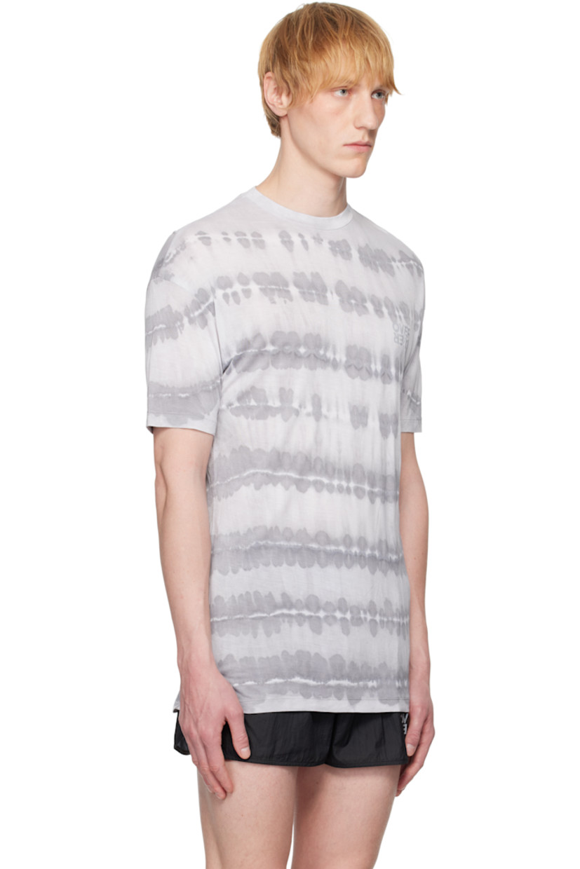 Collagenic cotton jersey tank top. Tie-dye pattern throughout. 

· Anti-odor and antibacterial
· UV 50+ protection
· Rib-knit crewneck
· Reflective logo printed at chest
· Dropped shoulders

Each item is unique. Please note coloration may vary.

Supplier color: Windows dye