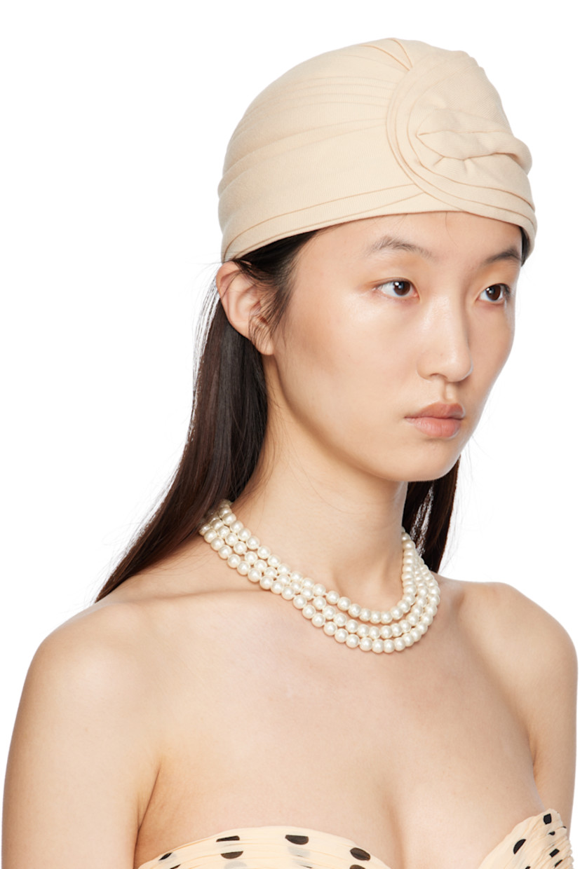 Structured virgin wool canvas hat.

· Logo hardware at back face
· Grosgrain browband
· Satin lining

Supplier color: Latte/Gold