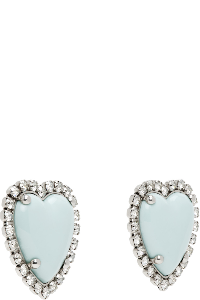 Pair of stud earrings in antiqued silver tone.

· Resin graphic and prong-set Swarovski crystals at face
· Clip-on fastening
· H1.75" x W1.5"

Supplier color: Palladium/Azure