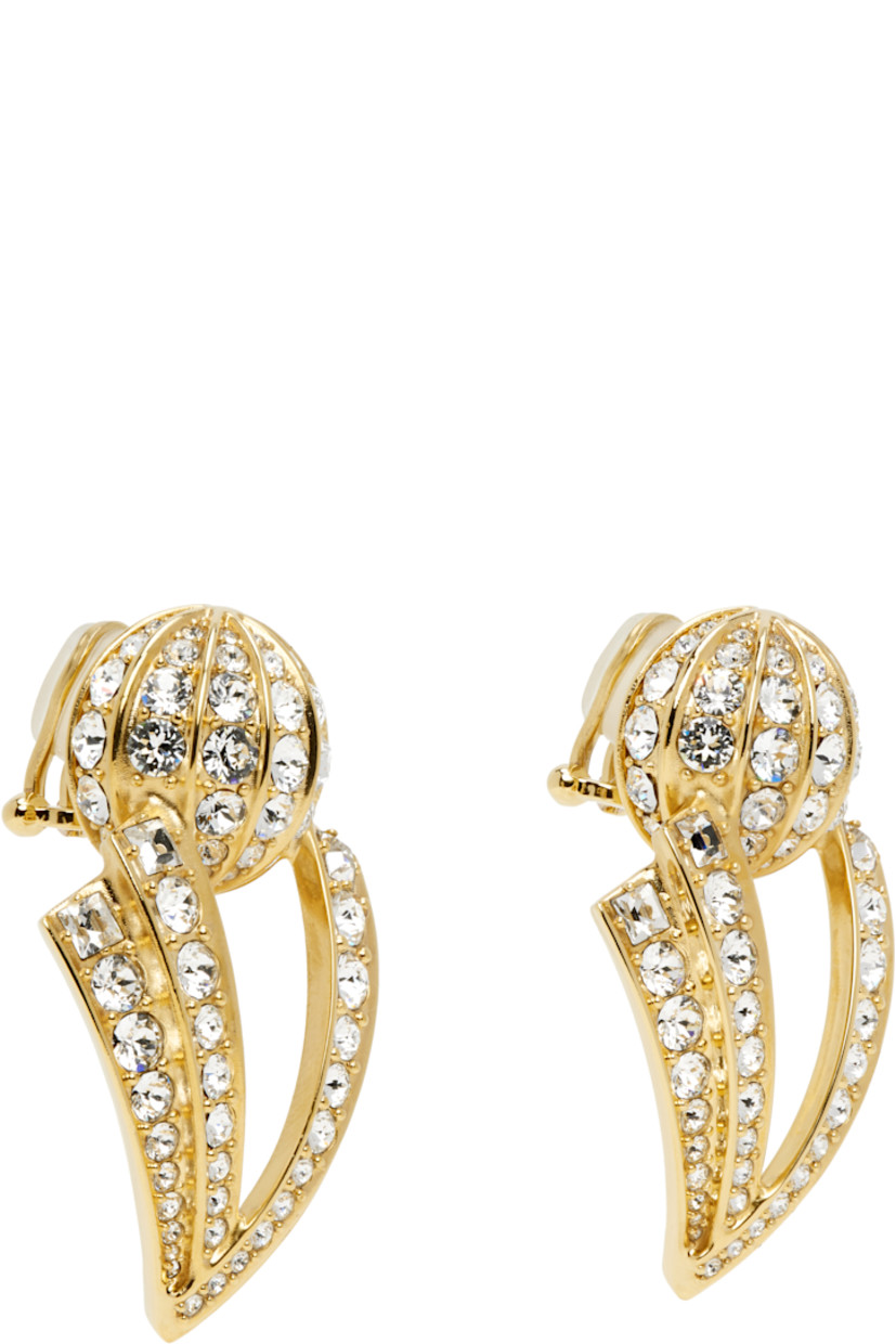 Pair of drop earrings in gold tone.

· Pavé-set crystals throughout
· Clip-on fastening
· H2.25" x W1.5"

Supplier color: Oro/Crystal