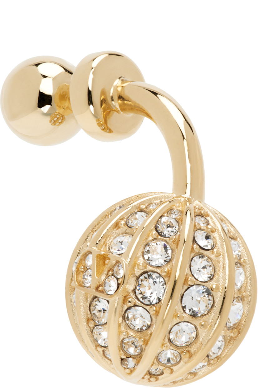 Single drop earring in gold tone. 

· Graphic charm with Swarovski crystals
· Post-stud fastening 
· H1.5" x W0.5"

Supplier color: Gold/Crystal