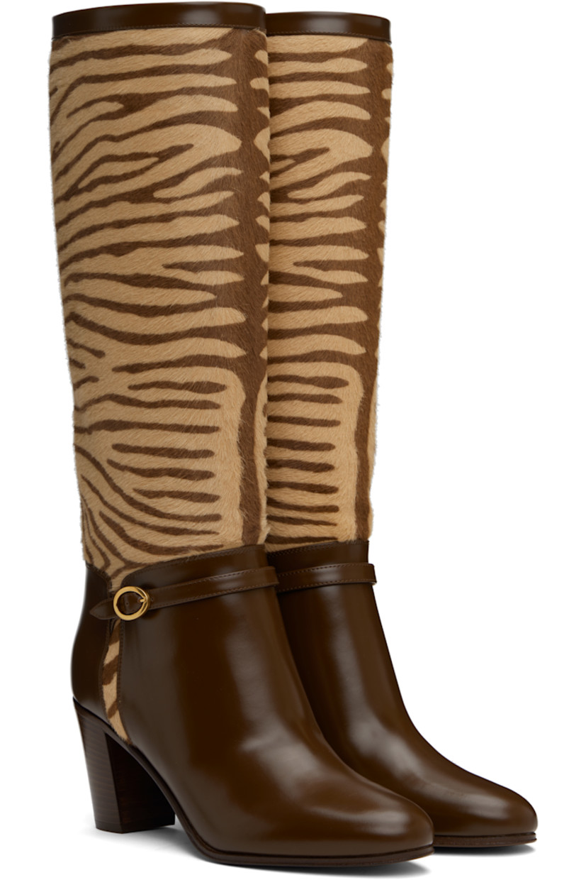Knee-high calf-hair and buffed calfskin boots in brown and beige. 

· Graphic pattern printed throughout
· Pin-buckle strap at vamp
· Buffed leather lining
· Logo hardware at heel
· Stacked leather block heel with rubber injection 
· Leather sole
· Antiqued brass-tone hardware
· Heel: H3"

Supplier color: Beige/Tobacco
