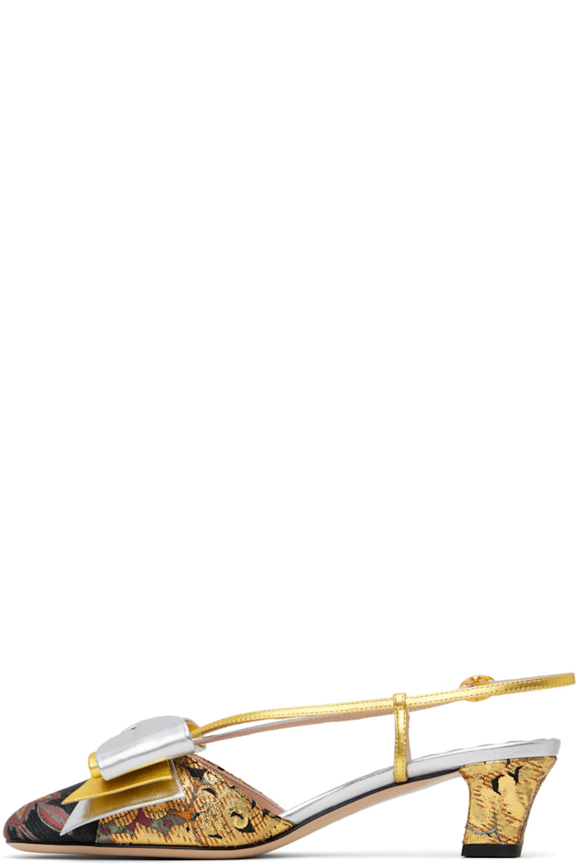 Grained leather and brocade heels in silver tone, gold tone, and black.

· Jacquard pattern throughout
· Bow accent at vamp
· Pin-buckle slingback strap
· Covered block heel with rubber injection
· Logo hardware at heel
· Leather sole
· Heel: H1.75"

Supplier color: Jacquard multi