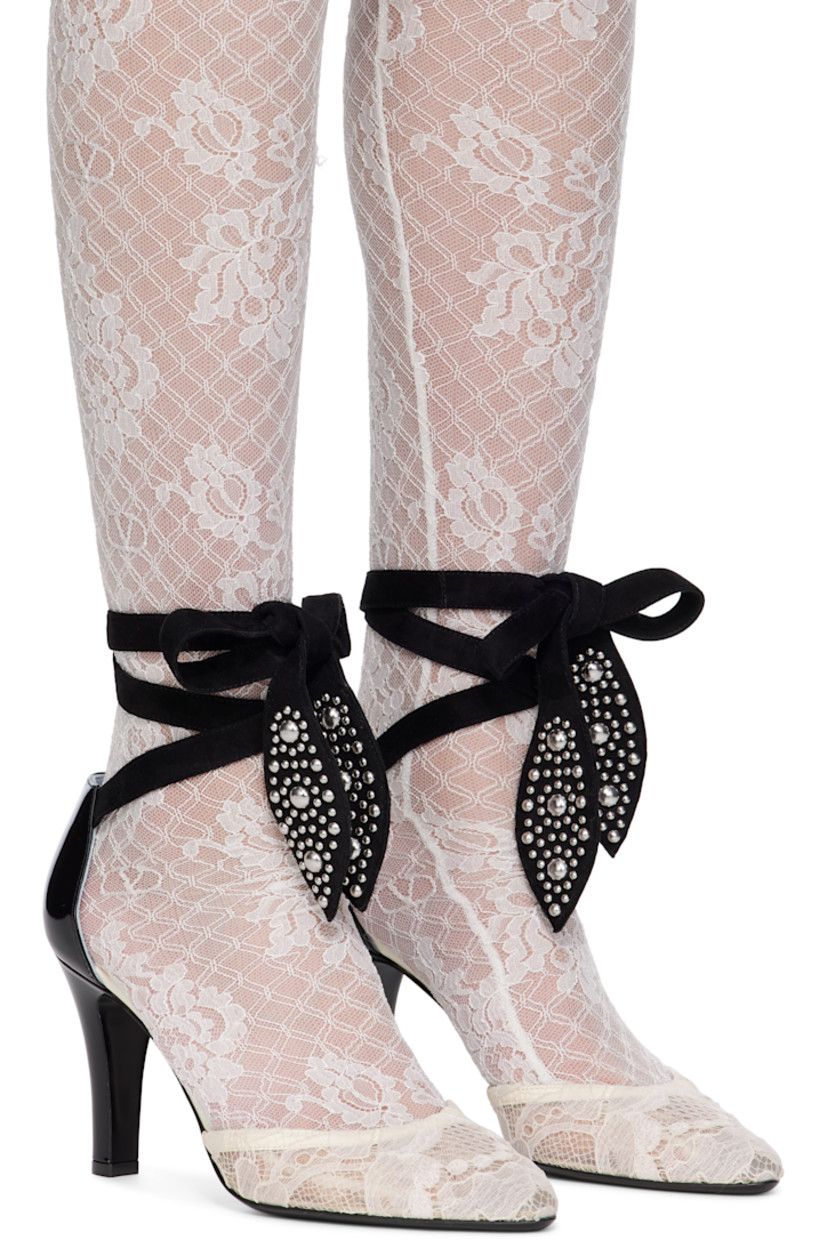 Patent calfskin and lace heels. 

· Pointed toe
· Studs at wraparound leather ankle strap
· Logo hardware at heel 
· Covered stiletto heel with rubber injection 
· Leather sole 
· Heel: H3.5"

Supplier color: Ivory/Nude/Black