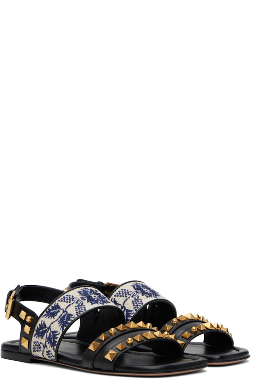 Buffed leather sandals in black.

· Signature pyramid studs throughout
· Open square toe
· Graphic-embroidered strap at vamp
· Pin-buckle slingback strap
· Buffed leather lining
· Logo printed at padded footbed
· Polished leather sole with rubber injection
· Antiqued brass-tone hardware

Supplier color: Black