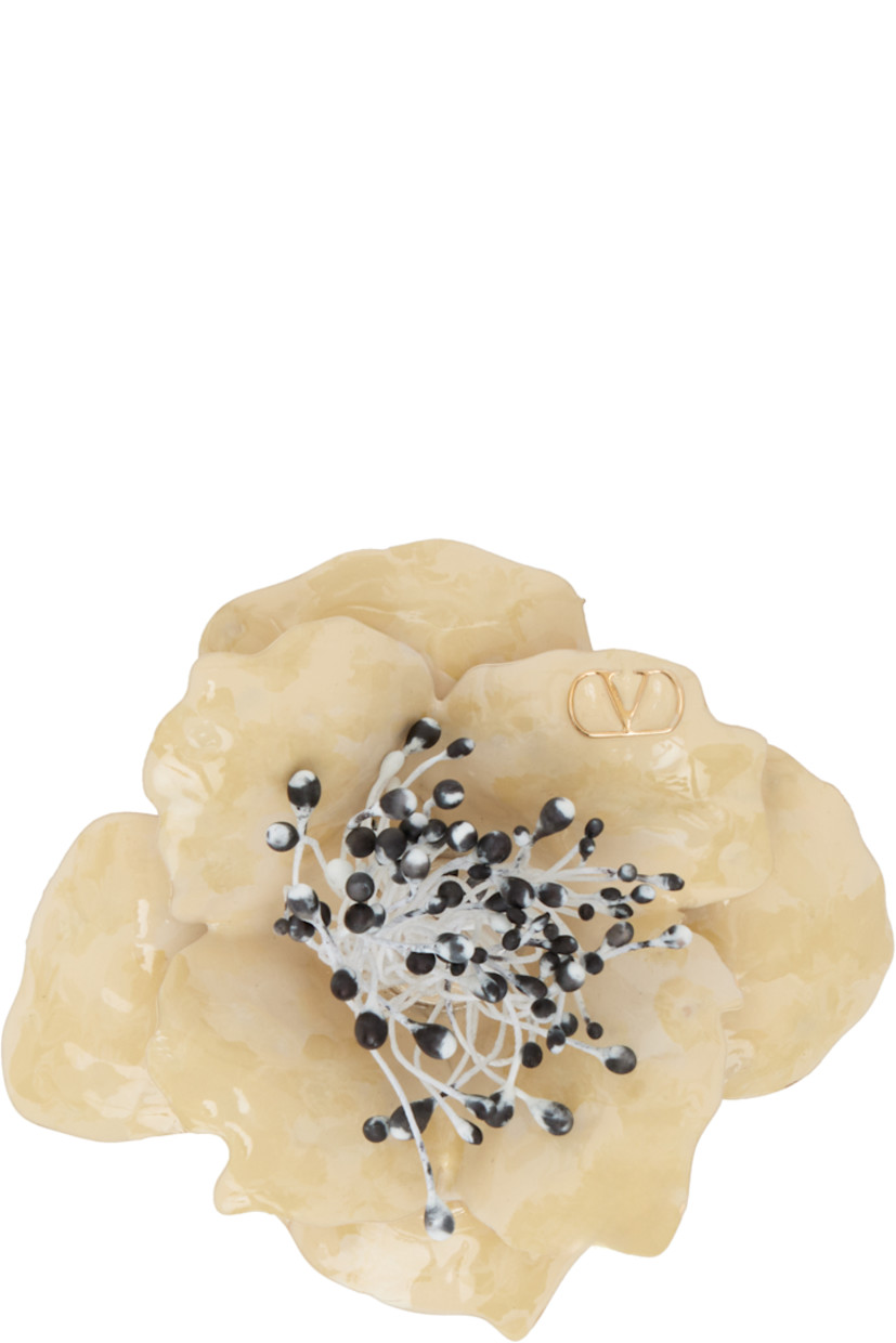 Graphic enameled metal pin in off-white.

· Logo hardware and hand-painted pistils at face
· Safety-pin fastening 
· H1.6" x W1.6"

Supplier color: Gold/Ivory/Multicolor