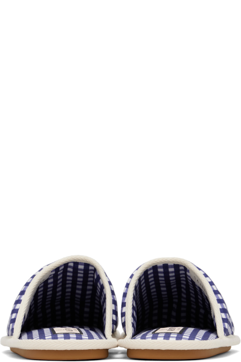 Quilted canvas slippers in blue and white. 

· Check pattern throughout
· Leather patch with logo hardware at vamp
· Logo patch at padded footbed
· Logo-treaded rubber sole
· Gold-tone hardware

Supplier color: Ivory/Bright indigo