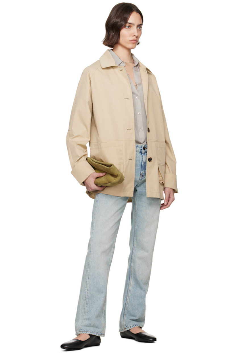 Oversized cotton- and nylon-blend gabardine jacket.

· Spread collar
· Button closure
· Patch pockets
· Button vent at side seams
· Raglan sleeves
· Storm flap at back
· Full bemberg satin lining

Supplier color: Oyster compact cotton