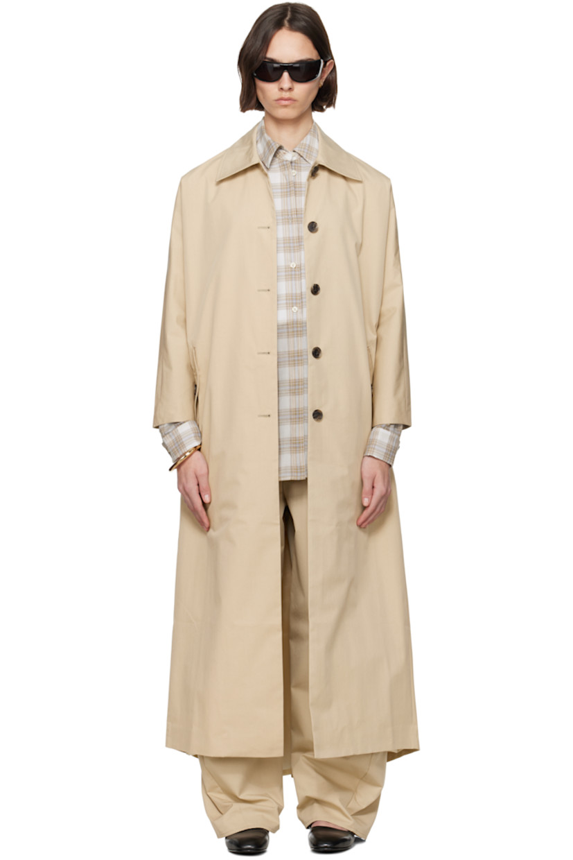 Oversized cotton- and nylon-blend gabardine trench coat.

· Spread collar
· Button closure
· Flap pockets
· Dropped shoulders
· Gathering at back collar
· Full bemberg satin lining

Supplier color: Oyster compact cotton