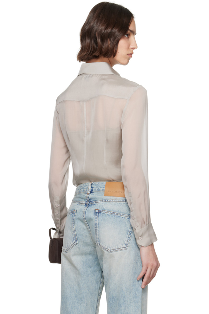 Sheer silk chiffon shirt.

· Spread collar
· Button closure
· Darts at front and back
· Shirttail hem
· Buttoned barrel cuffs

Supplier color: Pearl silk chiffon