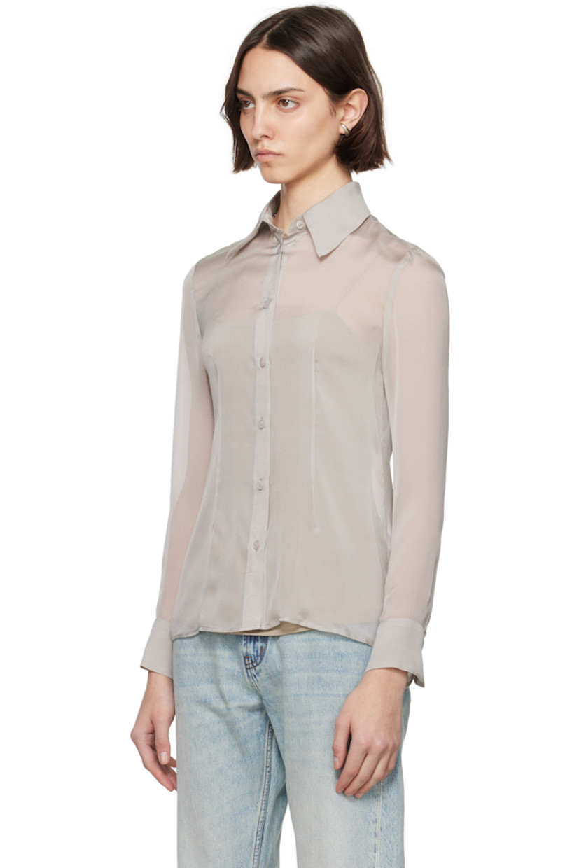 Sheer silk chiffon shirt.

· Spread collar
· Button closure
· Darts at front and back
· Shirttail hem
· Buttoned barrel cuffs

Supplier color: Pearl silk chiffon