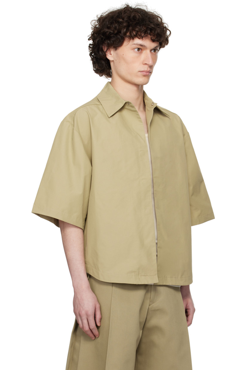 Cotton-blend ottoman shirt. 

· Spread collar
· Magnetic closure
· Seam pockets
· Shirttail hem
· Dropped shoulders
· Box pleat at back yoke

Supplier color: Biscuit