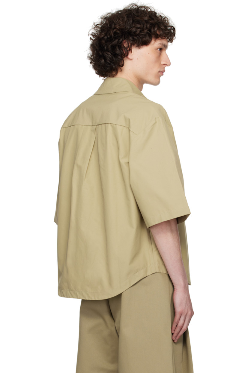 Cotton-blend ottoman shirt. 

· Spread collar
· Magnetic closure
· Seam pockets
· Shirttail hem
· Dropped shoulders
· Box pleat at back yoke

Supplier color: Biscuit