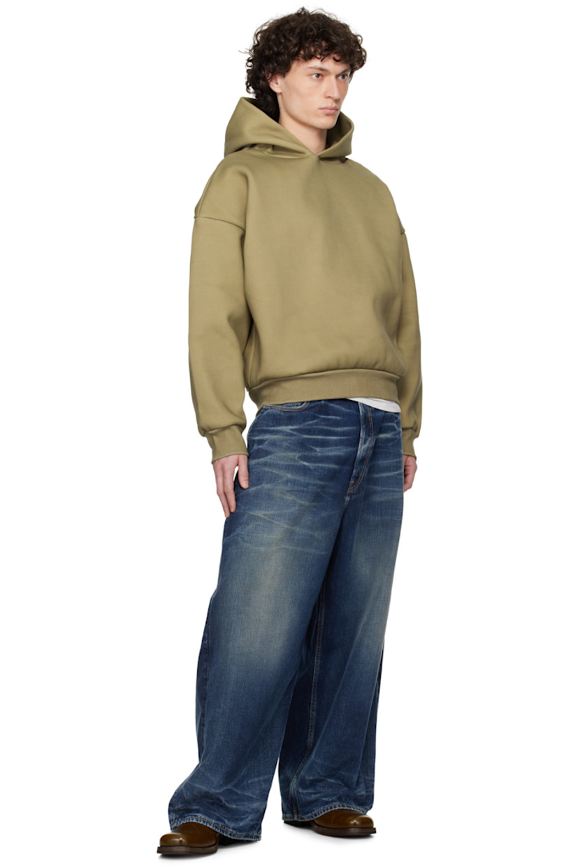 Double-faced 610 gsm cotton-blend jersey hoodie.

· Rib-knit hem and cuffs
· Dropped shoulders

Supplier color: Mustard