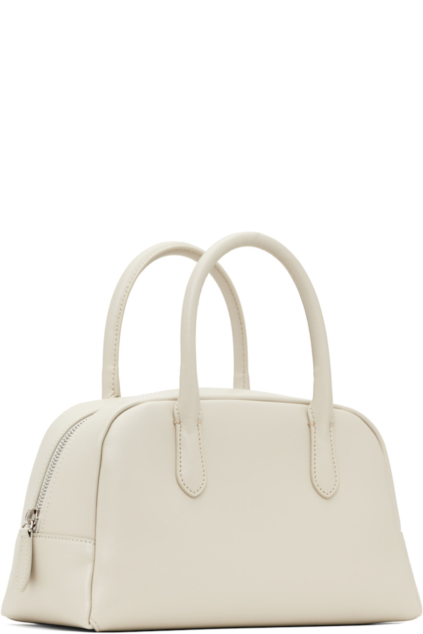 Buffed leather top handle bag in off-white.

· Fixed carry handles
· Zip closure
· Zip pocket at interior
· Canvas lining
· H6.25" x W11" x D5"

Supplier color: Oyster white