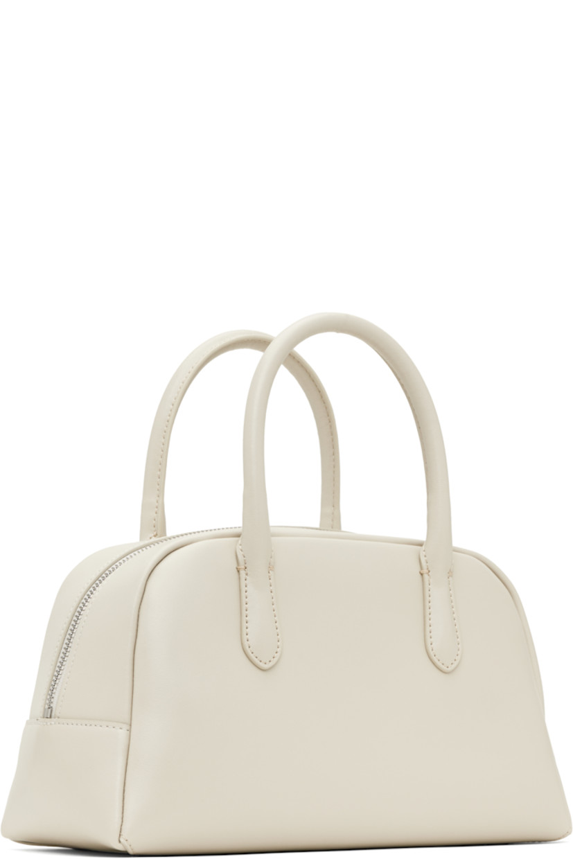 Buffed leather top handle bag in off-white.

· Fixed carry handles
· Zip closure
· Zip pocket at interior
· Canvas lining
· H6.25" x W11" x D5"

Supplier color: Oyster white