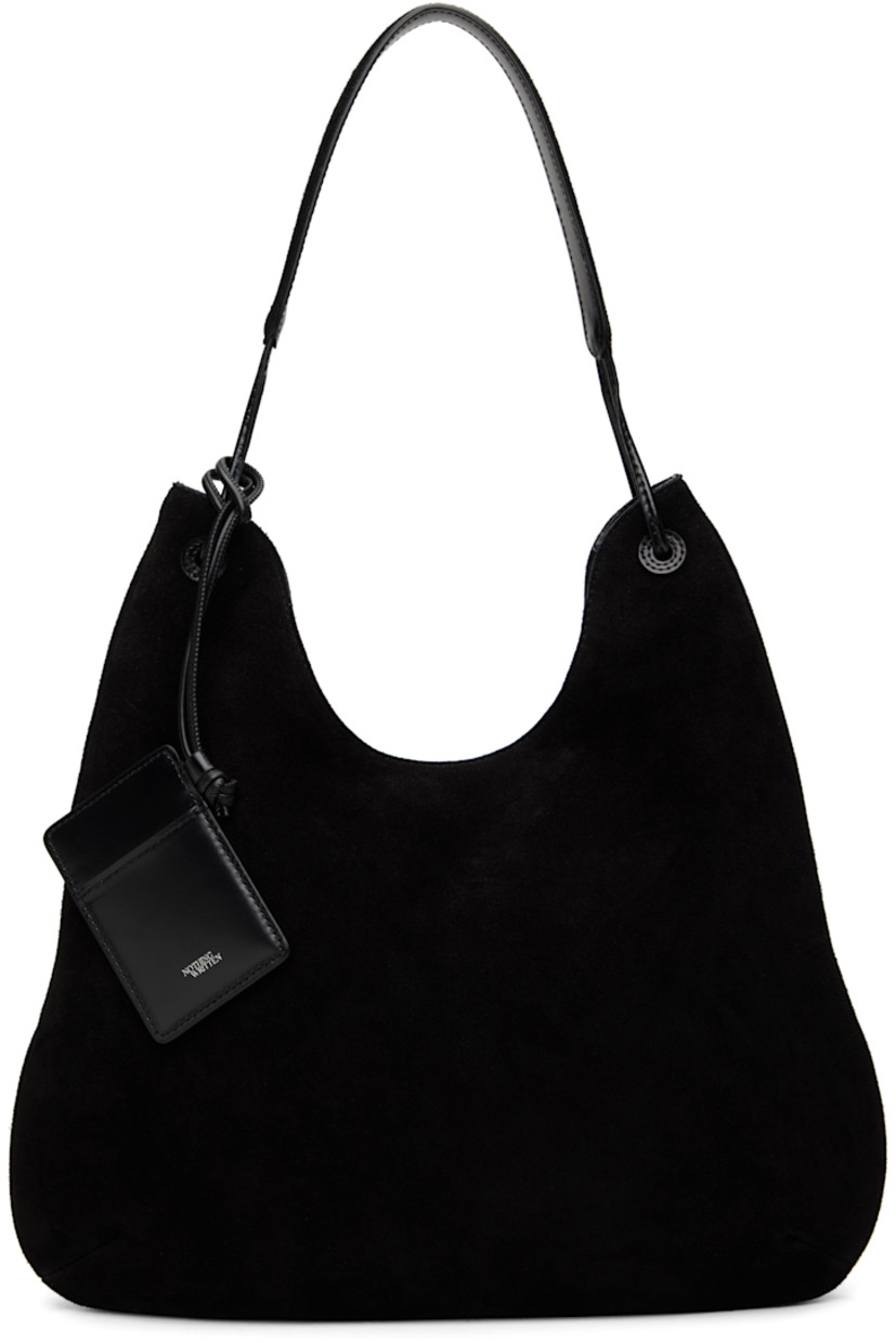 Suede shoulder bag in black.

· Fixed shoulder strap
· Detachable card holder at strap
· Magnetic closure
· Patch pocket at interior
· Cotton canvas lining
· H14" x W15.5" x D1.5"

Supplier color: Black suede