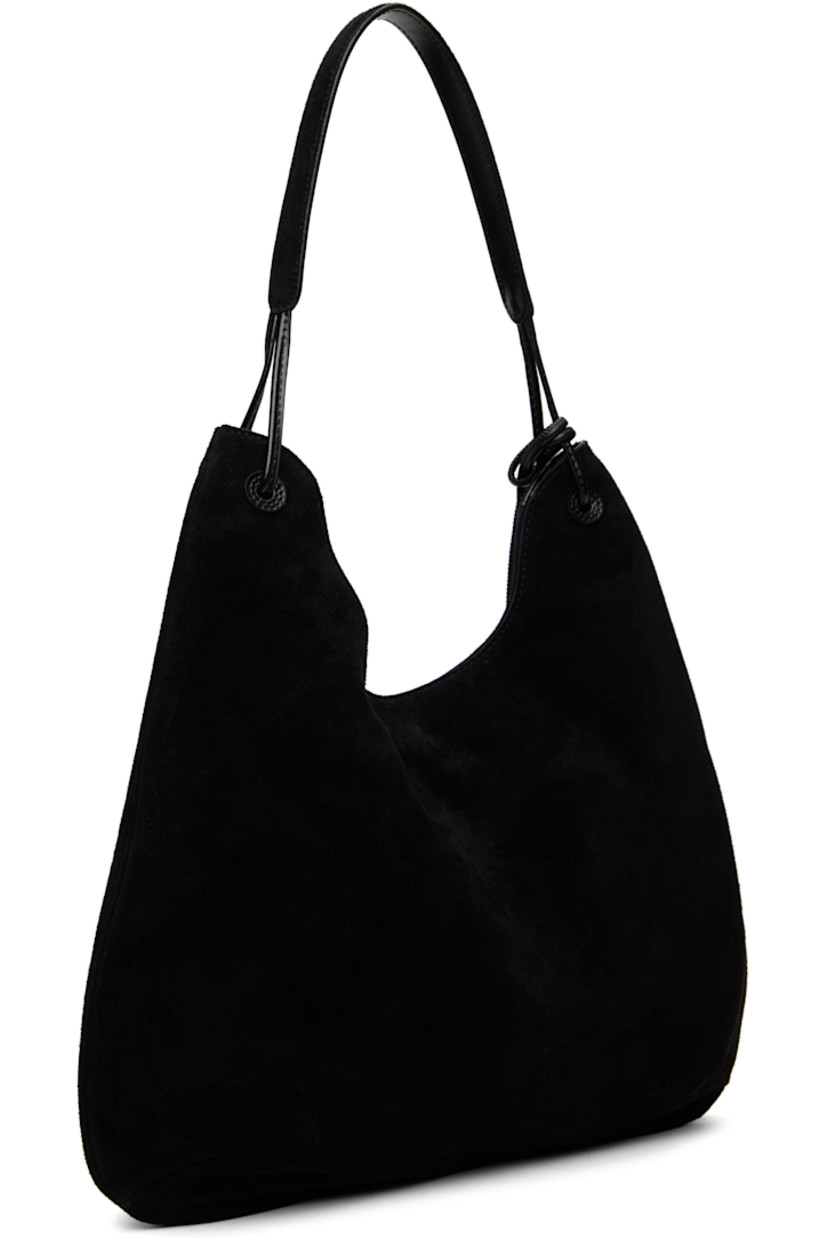 Suede shoulder bag in black.

· Fixed shoulder strap
· Detachable card holder at strap
· Magnetic closure
· Patch pocket at interior
· Cotton canvas lining
· H14" x W15.5" x D1.5"

Supplier color: Black suede