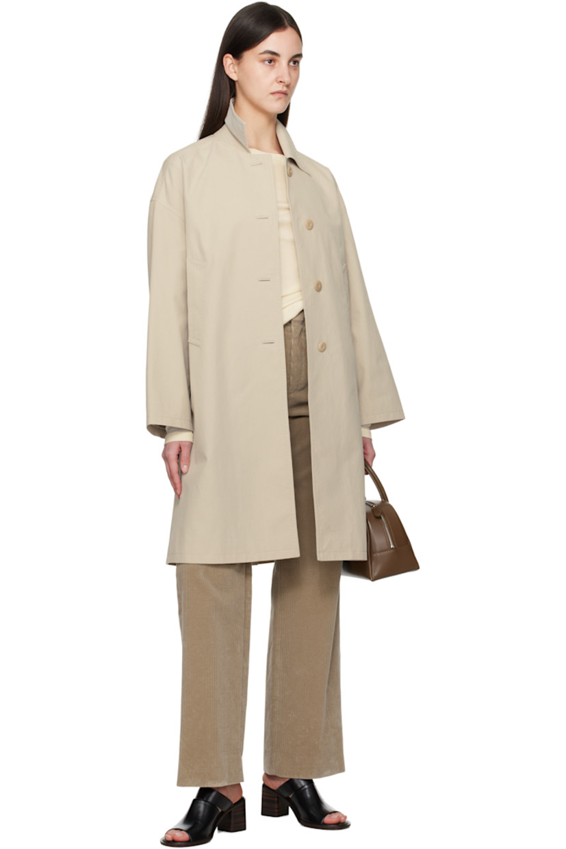 Cotton-blend twill coat.

· Spread collar
· Button closure
· Welt pockets
· Dropped shoulders
· Button tab at cuffs
· Central vent at back hem
· Full satin lining
· Logo-engraved nut hardware

Supplier color: Beige