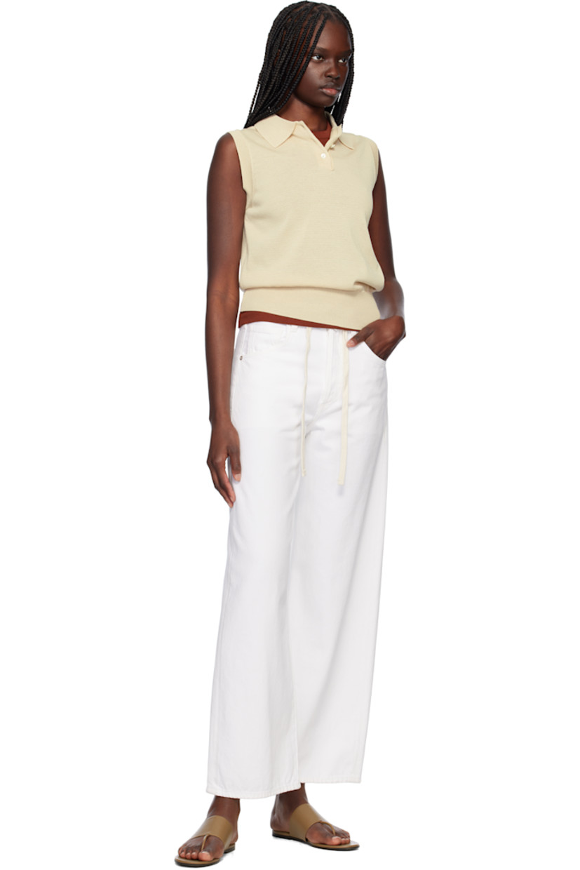 Knit viscose-blend polo.

· Rib-knit spread collar, hem, and armscyes
· Three-button placket

Supplier color: Beige