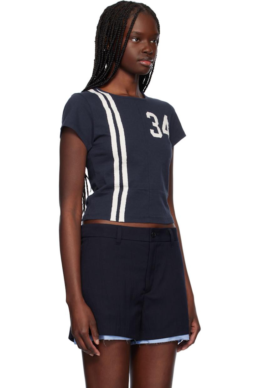 Cotton jersey T-shirt.

· Paneled construction
· Rib-knit crewneck
· Stripes at front
· Text appliqués at chest and back
· Cropped hem

Supplier color: Navy