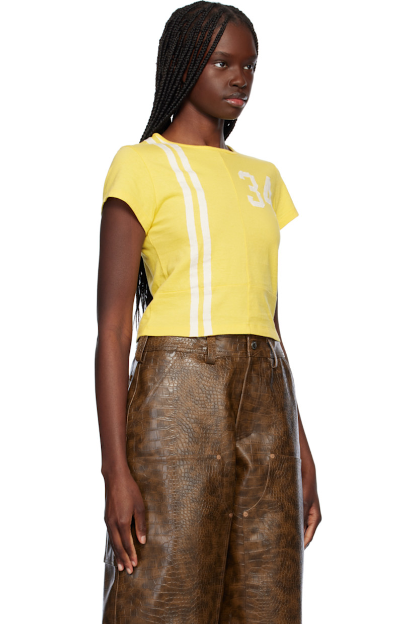 Cotton jersey T-shirt.

· Paneled construction
· Rib-knit crewneck
· Stripes at front
· Text appliqués at chest and back
· Cropped hem

Supplier color: Yellow