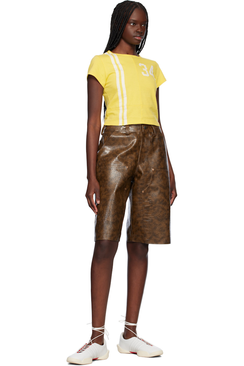 Cotton jersey T-shirt.

· Paneled construction
· Rib-knit crewneck
· Stripes at front
· Text appliqués at chest and back
· Cropped hem

Supplier color: Yellow