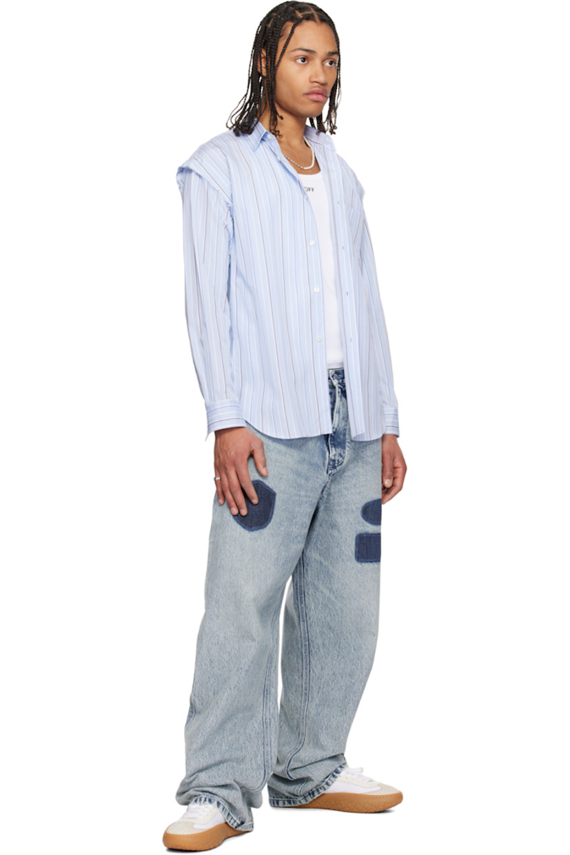 Relaxed-fit non-stretch denim jeans. Fading throughout.

· Belt loops
· Five-pocket styling
· Zip-fly
· Graphics printed at front
· Hammer loop and patch pocket at outseam 
· Patch pockets at outseams

Supplier color: Blue