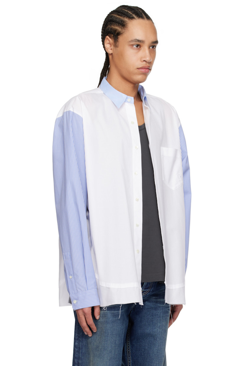 Cotton canvas and poplin shirt.

· Paneled construction
· Spread collar
· Button closure
· Logo-embroidered patch pocket at chest
· Raw edge at hem
· Vented side seams
· Stripes at sleeves
· Buttoned barrel cuffs
· Twin pleats at back yoke

Supplier color: White