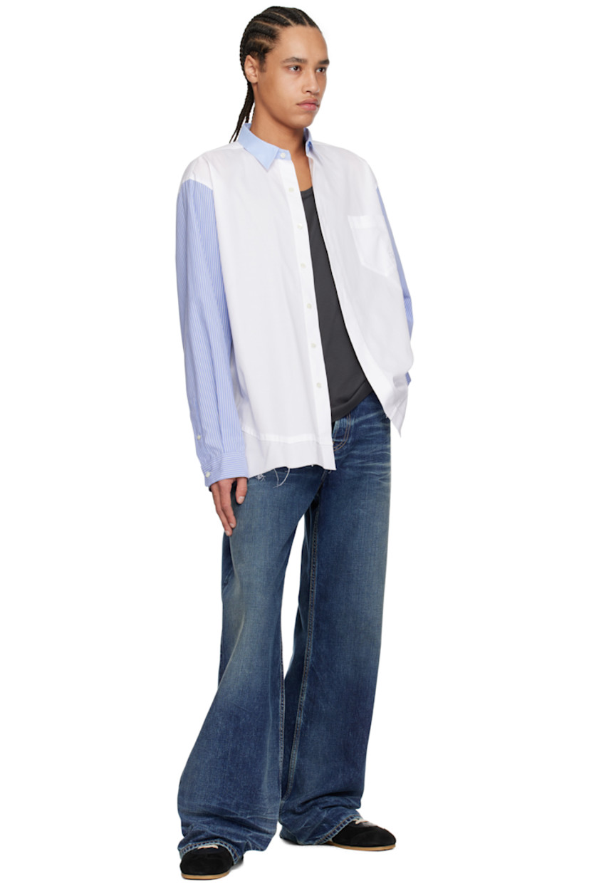 Cotton canvas and poplin shirt.

· Paneled construction
· Spread collar
· Button closure
· Logo-embroidered patch pocket at chest
· Raw edge at hem
· Vented side seams
· Stripes at sleeves
· Buttoned barrel cuffs
· Twin pleats at back yoke

Supplier color: White