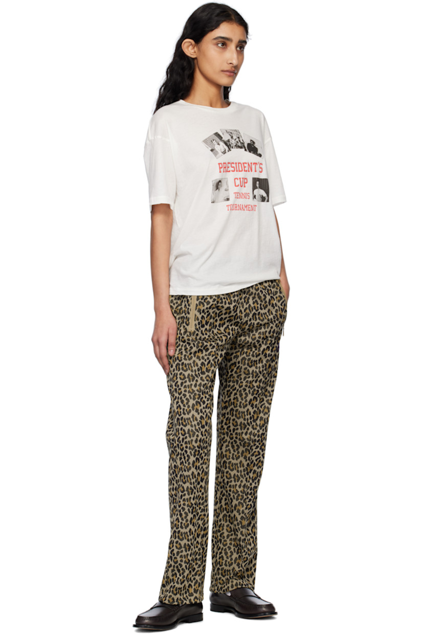 Polyester jersey track pants. Jacquard leopard pattern throughout. 

· Concealed drawstring at elasticized waistband
· Three-pocket styling
· Logo graphic embroidered at front
· Pinched seam at front legs
· Unlined 

Supplier color: Leopard
