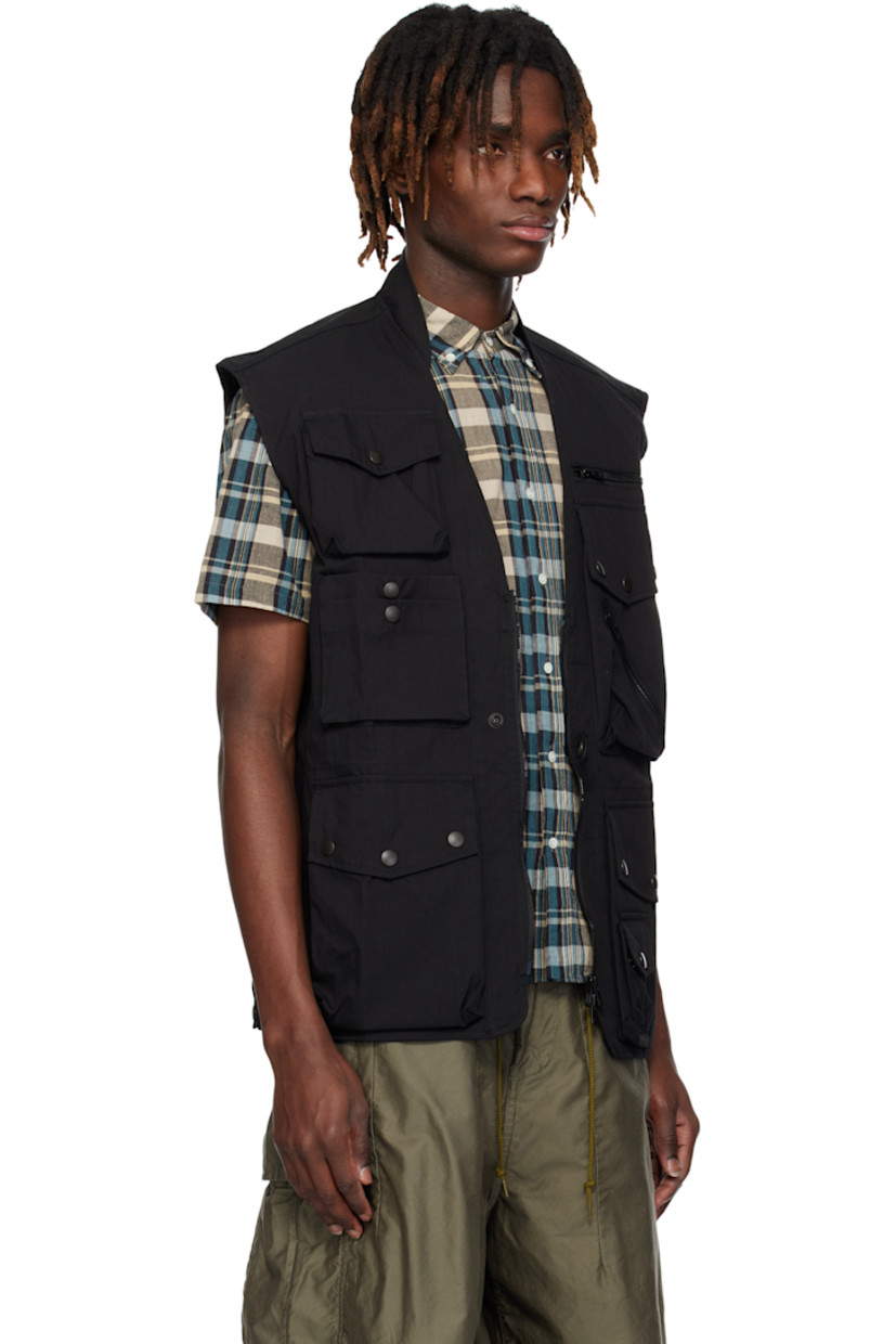 Cotton-blend oxford cloth vest.

· Stand collar
· Y-neck
· Press-stud tab at two-way zip closure
· Zip and bellows pockets at front
· Bellows pocket at back
· Adjustable press-stud tab at back hem
· Patch pockets at interior

Supplier color: Black