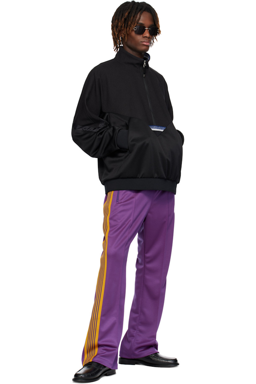 Bootcut polyester interlock jersey track pants.

· Concealed drawstring at elasticized waistband
· Three-pocket styling
· Pinched seams and embroidered logo graphic at front
· Striped knit trim at outseams

Supplier color: Purple