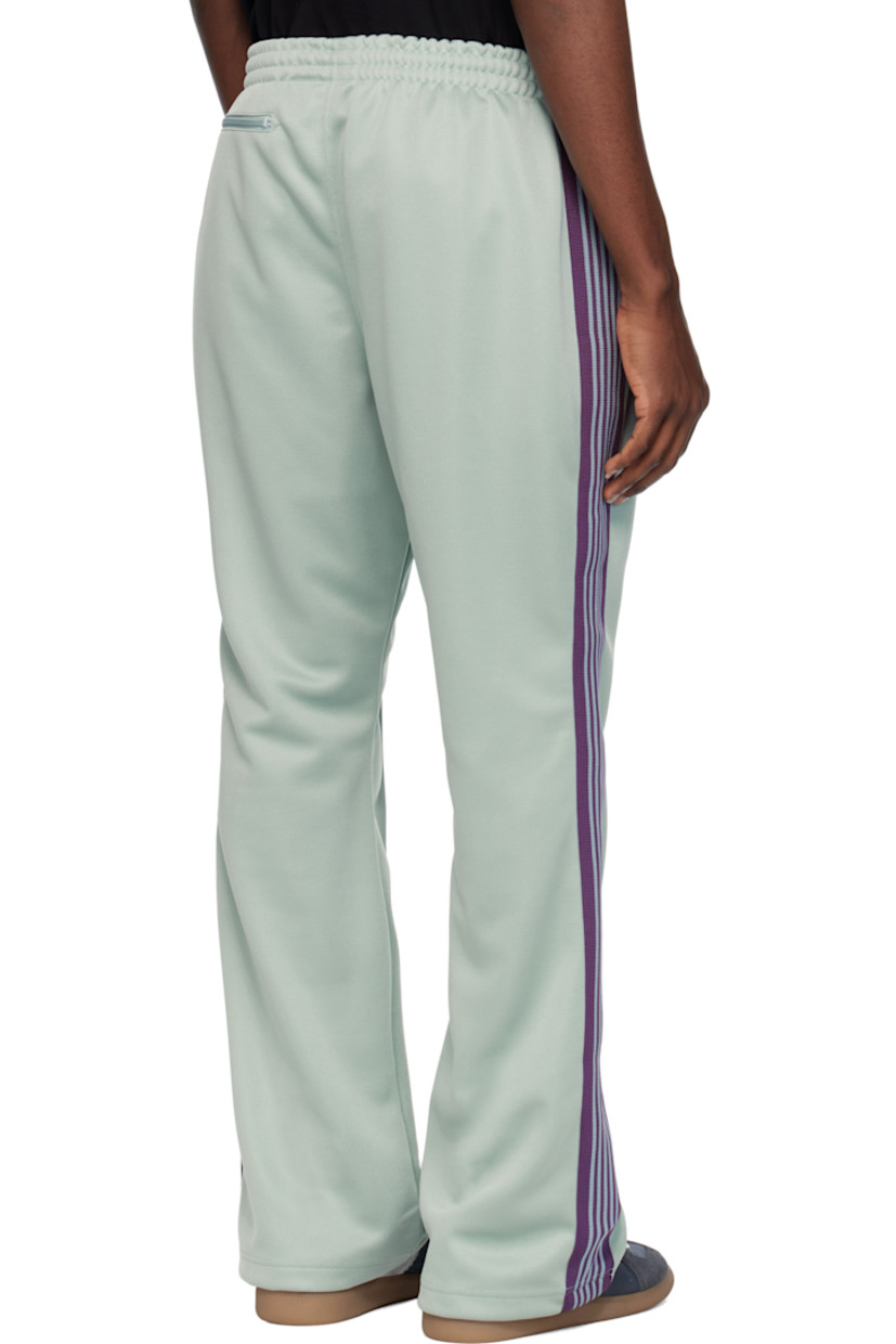 Bootcut polyester interlock jersey track pants.

· Concealed drawstring at elasticized waistband
· Three-pocket styling
· Pinched seams and embroidered logo graphic at front
· Striped knit trim at outseams

Supplier color: Sax