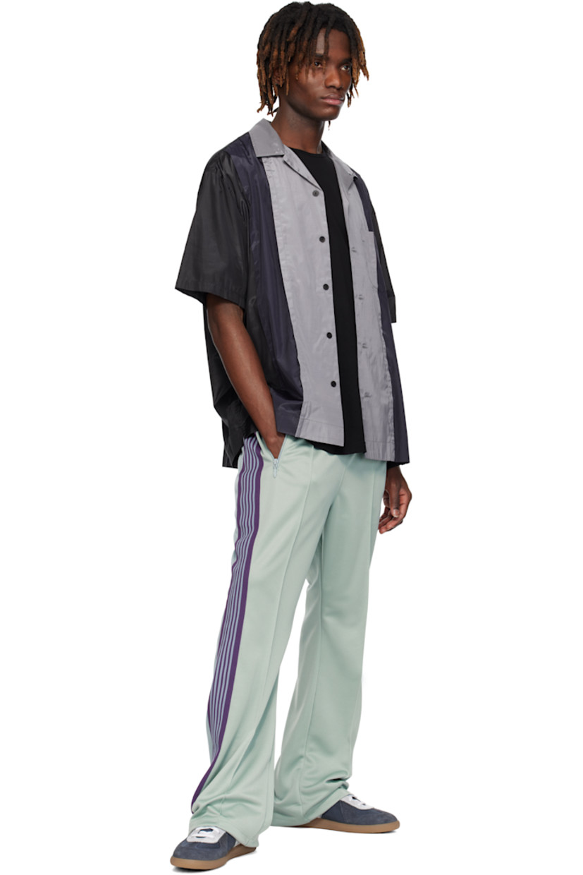 Bootcut polyester interlock jersey track pants.

· Concealed drawstring at elasticized waistband
· Three-pocket styling
· Pinched seams and embroidered logo graphic at front
· Striped knit trim at outseams

Supplier color: Sax