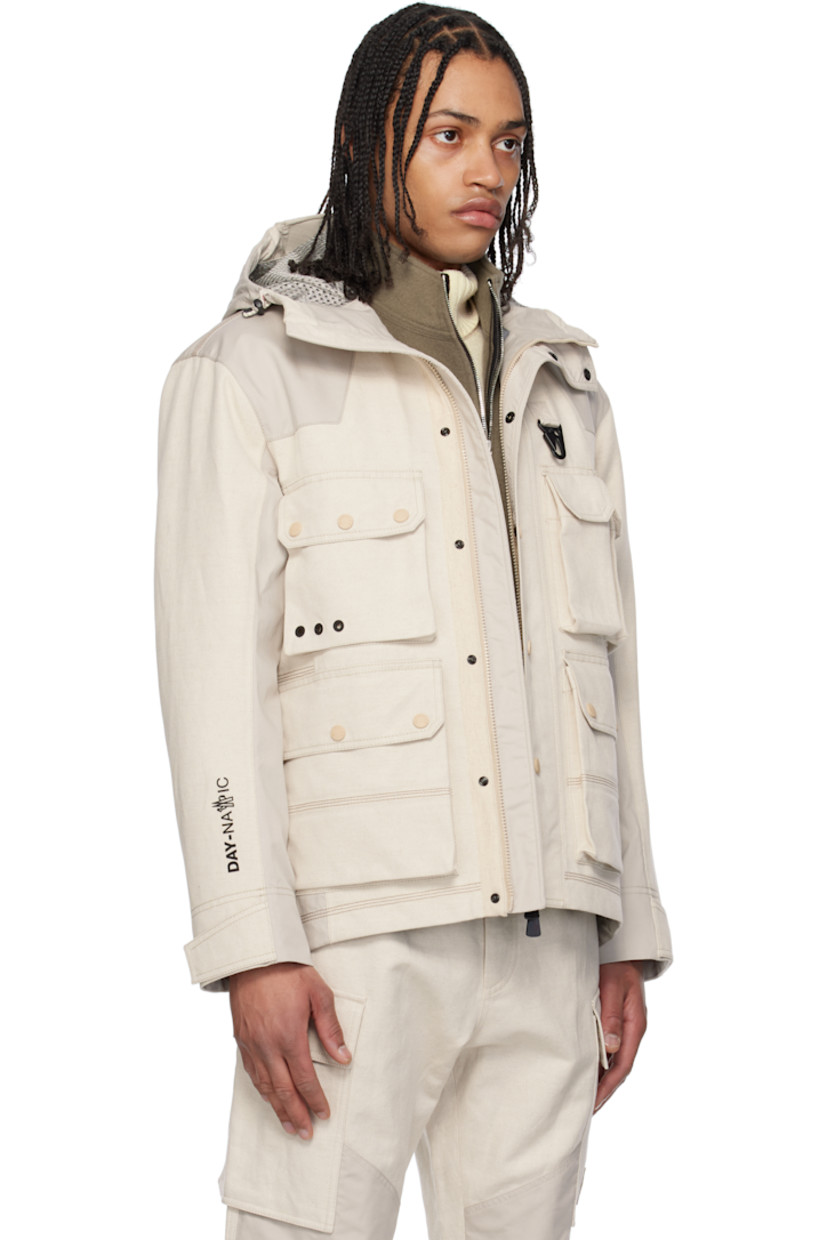 Lightweight cotton-blend canvas and broadcloth jacket.

· Windproof and waterproof 
· Paneled construction 
· Bungee-style drawstring at hood
· Concealed two-way zip closure
· Press-stud placket
· Lanyard clasp and grommets at chest
· Bellows and zip pockets  
· Suede logo patch at sleeve
· Adjustable velcro tab at cuffs
· Rubberized text bonded at cuff
· Partial mesh lining 

Part of the Day-Namic collection.

Supplier color: Soft beige