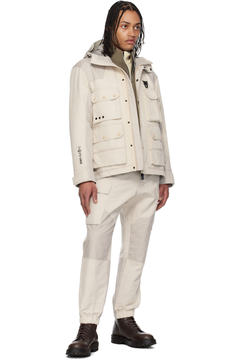 Lightweight cotton-blend canvas and broadcloth jacket.

· Windproof and waterproof 
· Paneled construction 
· Bungee-style drawstring at hood
· Concealed two-way zip closure
· Press-stud placket
· Lanyard clasp and grommets at chest
· Bellows and zip pockets  
· Suede logo patch at sleeve
· Adjustable velcro tab at cuffs
· Rubberized text bonded at cuff
· Partial mesh lining 

Part of the Day-Namic collection.

Supplier color: Soft beige