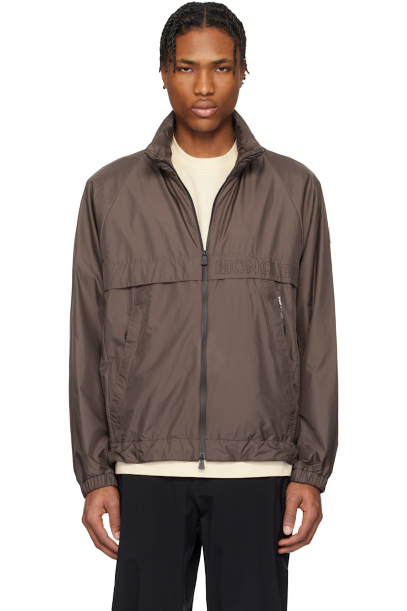 Packable nylon ripstop jacket. Lightweight, windproof, and water-repellent. 

· Bungee-style drawstring at stowaway hood
· Stand collar
· Two-way zip closure
· Perforated logo at front and back 
· Storm flap at front and back
· Zip pockets and printed text at front
· Concealed bungee-style drawstring at hem
· Embroidered logo patch at sleeve
· Zip vent at underarms
· Elasticized cuffs
· Reflective logo patch at back
· Full mesh lining
· Logo-engraved hardware

Supplier color: Chocolate