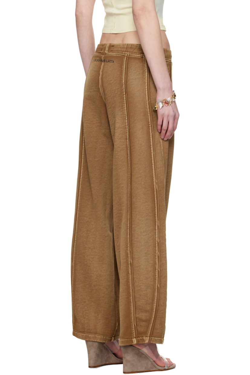 Wide-leg garment-washed brushed French terry lounge pants. Fading throughout.

· Mid-rise
· Drawstring at elasticized waistband
· Two-pocket styling
· Pinched seams at front and back
· Logo printed at back waistband

Supplier color: Bison