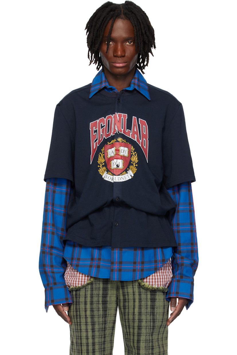 Cotton jersey and twill shirt. Check pattern throughout.

· Layered construction 
· Spread collar
· Button closure
· Logo graphic printed at front 
· Shirttail hem
· Pleats at single-button barrel cuffs
· Logo embroidered at back collar

Part of the EGONlab x Worldnet collaboration.

Supplier color: Bucheron plaid