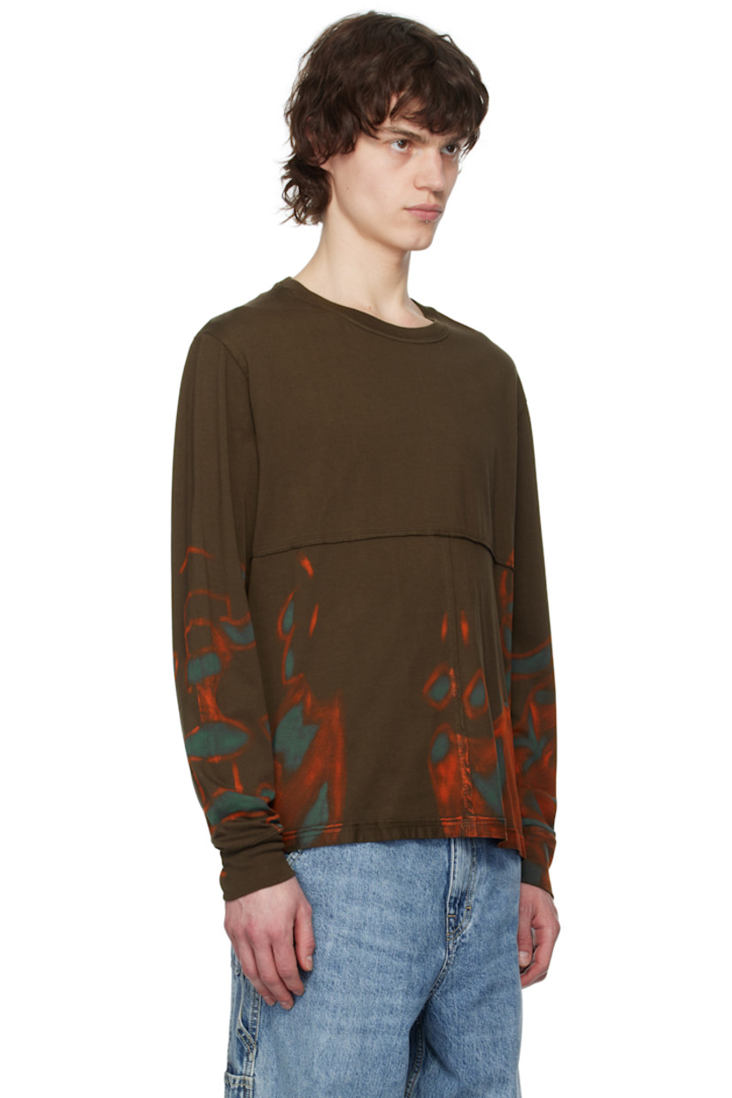 Cotton jersey T-shirt. Exposed seams with raw edges and graphic pattern throughout.

· Paneled construction
· Rib-knit crewneck
· Logo printed at front

Each item is unique. Please note that coloration may vary.

Supplier color: Oil